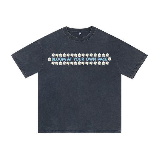 Front view of blue t恤 featuring BLOOM AT YOUR OWN PACE Vintage Tee
